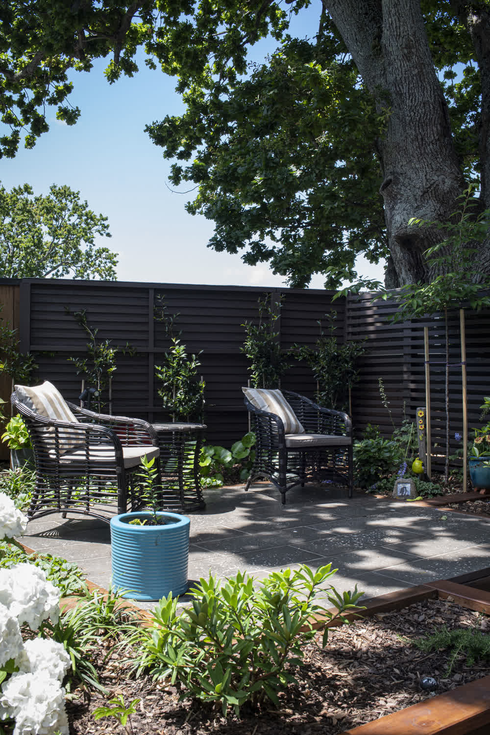 Cozy, shaded paved seating area